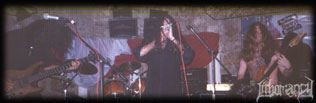 Lithomancy performing live — the full band on stage, recovered from the band's original website.